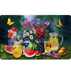 American Lemonade Comfort Mat with patriotic floral design and refreshing summer drink setup on grass.