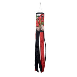 Red and black windsock with geranium design hanging from white string on white background.