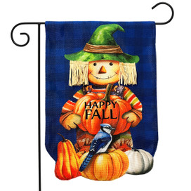 Happy Fall Scarecrow Burlap Garden Flag with pumpkins and blue bird on orange pumpkin display.