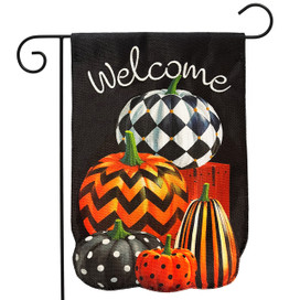 Black garden flag with Welcome and stacked patterned pumpkins in orange, black, and white burlap design.