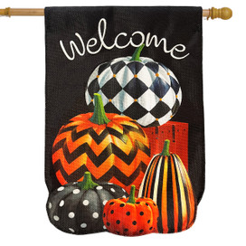 Black burlap house flag with welcome and stacked patterned pumpkins in orange, black, and white.