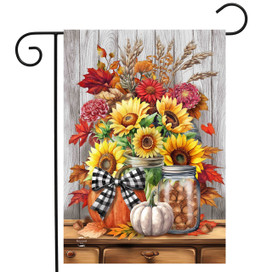 Sunflowers and Mums garden flag with fall decor, pumpkins, and flowers on a wooden table display.