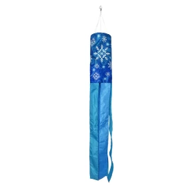Let It Snow Snowflakes Wind Spinner, blue cylindrical decoration with white snowflakes and flowing ribbons hanging.