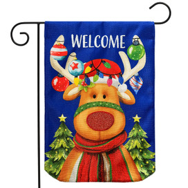 Rudolf Burlap Garden Flag with reindeer, Christmas trees, and ornaments on blue background with welcome text.