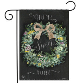 Home Sweet Home Wreath Garden Flag with floral wreath and burlap bow on black background.
