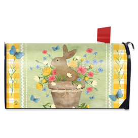 Brown bunny in flowerpot with colorful flowers and butterflies on yellow and green mailbox cover.