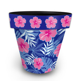 Large blue planter with pink and blue tropical floral pattern and pink flowers on top rim.