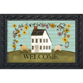 Country Saltbox Doormat with white house, two sheep, flowers, and welcome text on green hill.