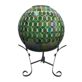 Green and purple solar LED glass gazing ball on a stand with hexagonal mosaic pattern.