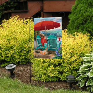 Briarwood Lane Beach Life Garden Flag with colorful beach scene and red umbrella on sand.