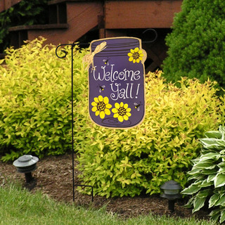 Briarwood Lane Welcome Y'all jar garden flag with colorful spring flowers on a decorative yard display.