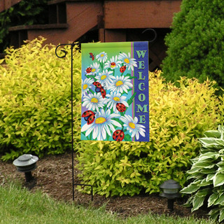 Briarwood Lane Ladybugs Spring Garden Flag with white flowers and ladybugs on a decorative yard display.