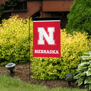 Briarwood Lane Nebraska Cornhuskers NCAA Licensed small garden flag with colorful printed design on display outdoors.
