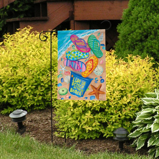 Briarwood Lane Better At The Beach Garden Flag with colorful beach designs on a small yard display.