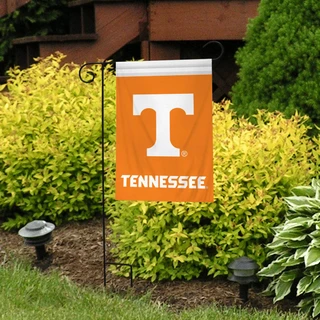 Briarwood Lane Tennessee Volunteers NCAA licensed garden flag on a lawn display stand outside.