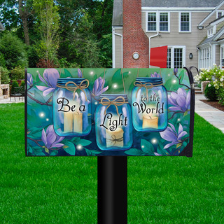 Briarwood Lane spring mailbox cover with inspirational quote and colorful candle design on a yard display.