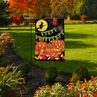 Briarwood Lane Halloween Haunts Garden Flag with jack-o-lanterns, bats, and spooky decorations on a lawn.
