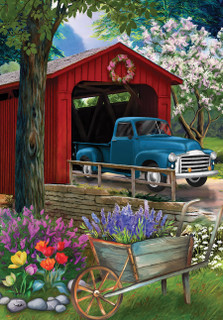 Briarwood Lane spring house flag with colorful covered bridge and vibrant springtime flowers design.