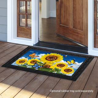 Briarwood Lane Sunflowers and Bees Summer Doormat with black border on wooden porch outside doorway.