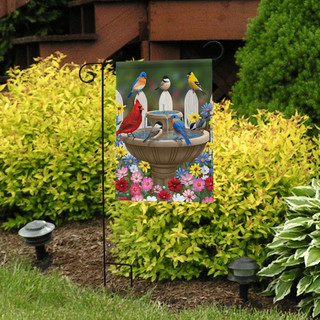 Briarwood Lane Birdbath Gathering Seasonal Garden Flag with cardinal, bluebird, Goldfinch, and chickadee on display.