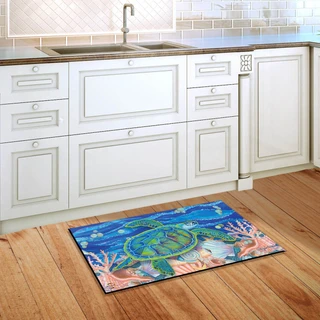 Briarwood Lane colorful Swimming Sea Turtle Summer Doormat on wooden kitchen floor beside white cabinets.