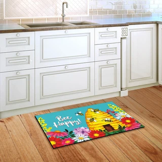 Briarwood Lane Bee Happy Hive spring doormat with colorful floral design on kitchen floor.