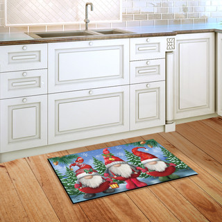 Briarwood Lane Winter Gnomes Christmas doormat with gnome trio, holly and berries, on indoor floor.