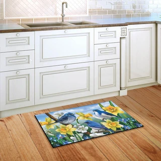 Briarwood Lane blue birds and daffodils spring indoor/outdoor door mat with floral design on kitchen floor.
