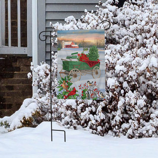 Briarwood Lane Winter Wagon Christmas Garden Flag with poinsettias and snow-covered rustic scene and pine tree.