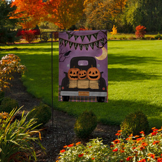Briarwood Lane Halloween primitive garden flag with jack-o-lanterns in a pick-up truck on purple background.