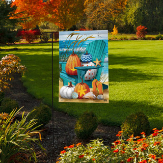 Briarwood Lane garden flag with pumpkins, gourds, and seashells on a colorful, small, printed design.