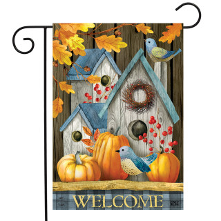 Briarwood Lane garden flag with colorful fall scene, bluebirds, pumpkins, and welcome message on porch decor.