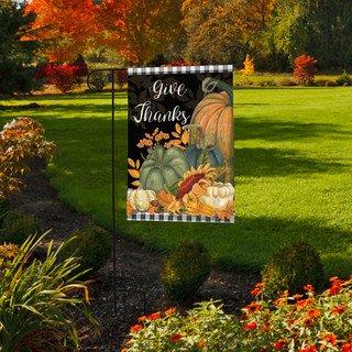 Briarwood Lane Checkered Give Thanks garden flag with colorful pumpkins and gourds on a lawn display.