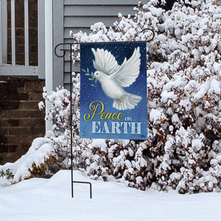 Briarwood Lane Christmas garden flag with white dove and olive branch on snowy winter porch display.