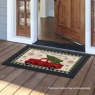 Briarwood Lane Merry Christmas doormat with red truck, spruce, berries, and checkered border on porch.