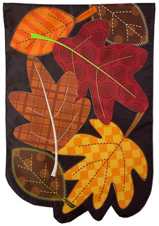 Briarwood Lane's Fallen Leaves Applique Autumn House Flag with colorful, turning leaves on a black background.