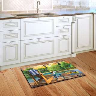 Briarwood Lane Lakeside Escape Summer Doormat on wooden floor in front of white kitchen cabinets.