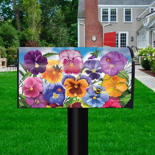 Briarwood Lane Pansies Spring Mailbox Cover with colorful floral design on a black mailbox post outdoors.