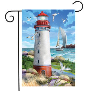 Briarwood Lane Coastal Lighthouse garden flag with sailboat, seagulls, and sunny ocean shore scene.
