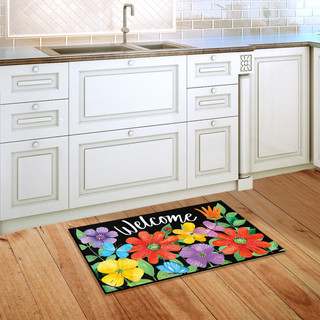 Briarwood Lane small printed welcome mat with colorful spring flowers on a kitchen floor.