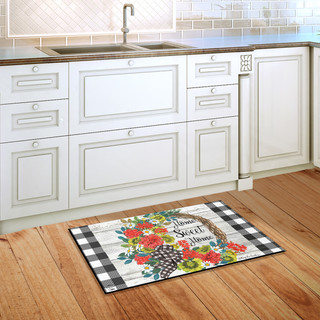 Briarwood Lane Geranium Wreath Summer Doormat on hardwood floor with kitchen cabinets and sink background.
