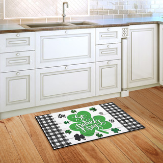 Briarwood Lane small printed St. Pat's Luck shamrock doormat on wooden floor with white cabinets.