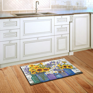 Briarwood Lane Rustic Sunflowers Summer Doormat on wooden kitchen floor beside white cabinets.