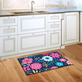 Briarwood Lane Bright Floral Spring Doormat on wooden floor beside kitchen sink and white cabinets.