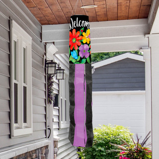 Briarwood Lane Whimsy Flowers Spring Windsock with colorful floral design and welcome text hanging outdoors.