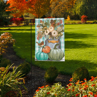 Briarwood Lane Pastel Pumpkins Fall Garden Flag with floral design and pumpkins on green background outdoors.