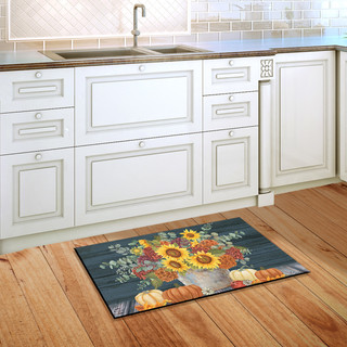 Briarwood Lane Sunflowers And Hydrangeas Fall Doormat on a wooden kitchen floor in front sink.