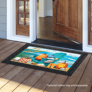 Briarwood Lane Fall At the Beach doormat with pumpkins and seashells on a wooden porch.