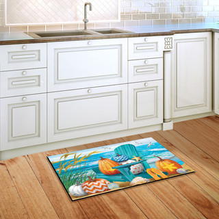 Briarwood Lane Fall At the Beach colorful doormat on a wooden kitchen floor near white cabinets.
