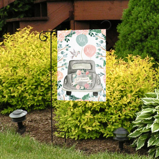 Briarwood Lane Just Married Burlap Garden Flag with floral and leaf design on display outdoors.